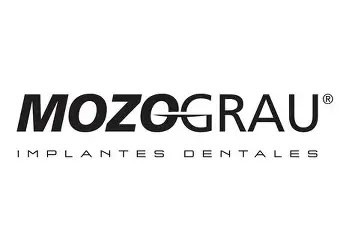 Logo for "Mozograu Implantes Dentales" with bold black text. The "O" in "MOZO" and "G" in "GRAU" are interlinked by a curved line. "IMPLANTES DENTALES" appears below in smaller, spaced letters.