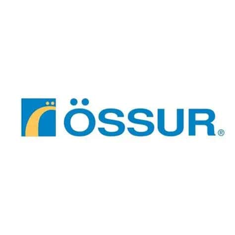 Össur logo featuring a stylized yellow arc and dot on a blue square, with the word "ÖSSUR" in bold blue letters to the right on a white background.